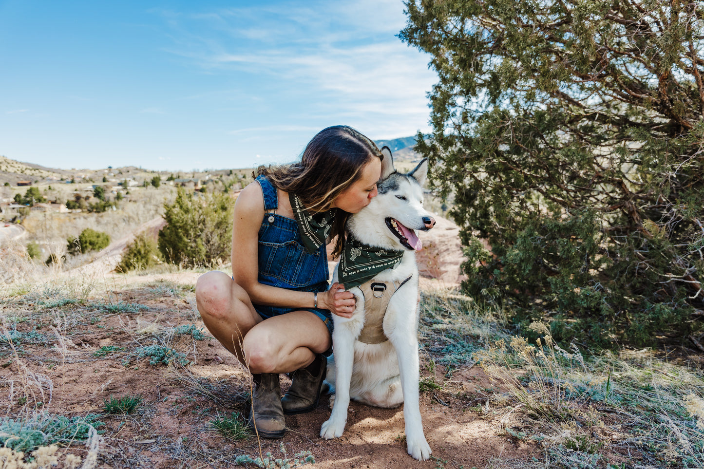 a couple of people that are holding a dog