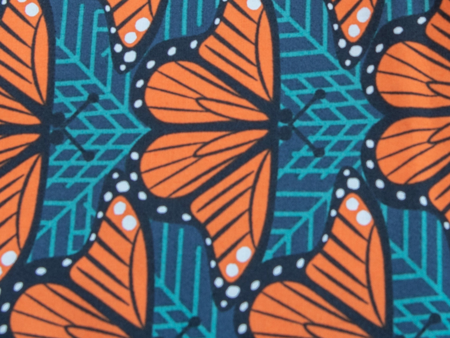 a group of orange and yellow striped umbrellas