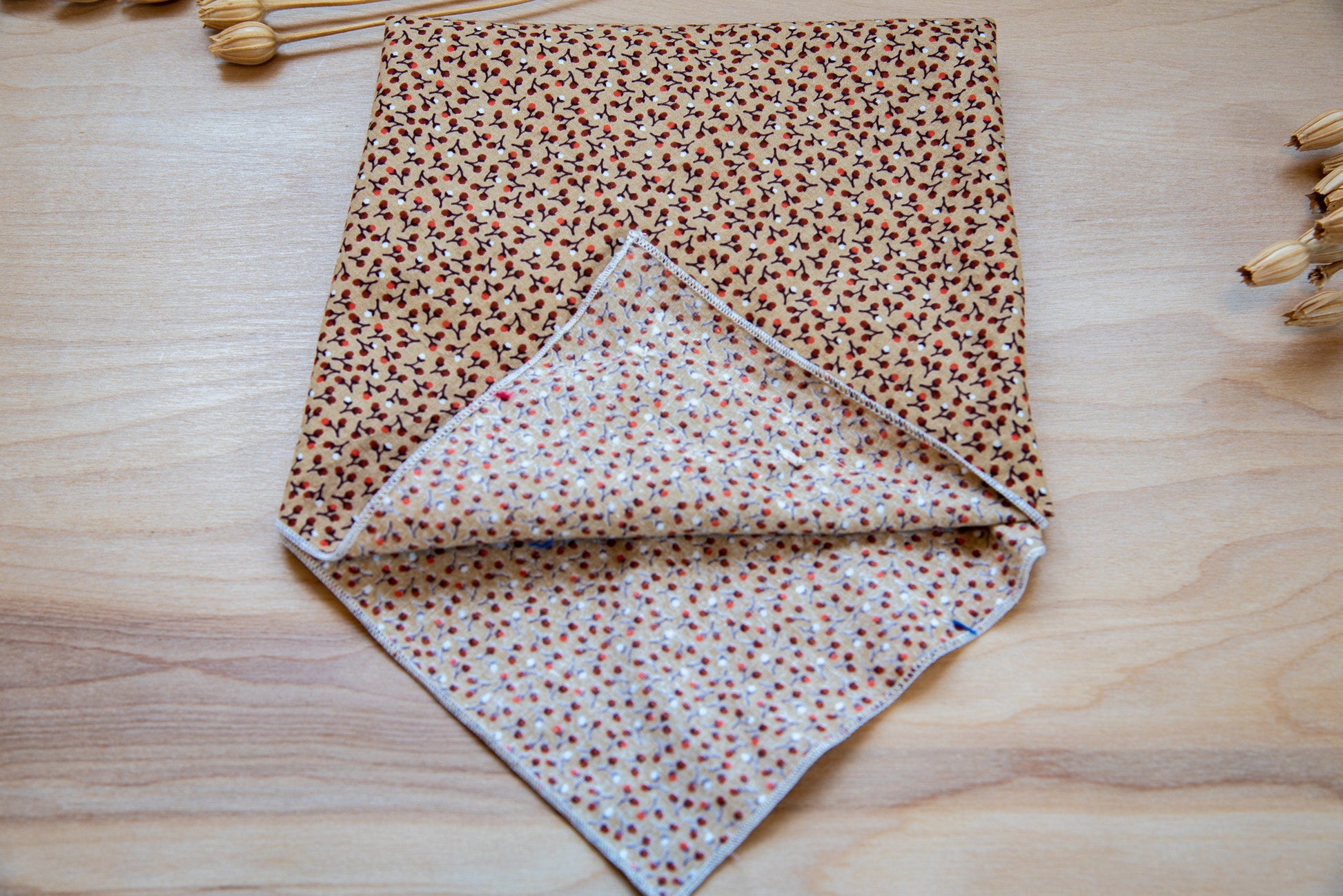 a close up of a purse on a wooden surface